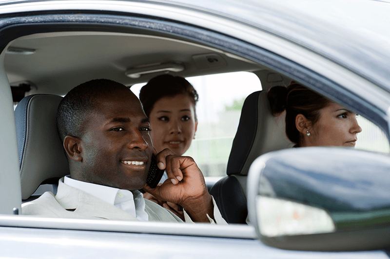 Persons Driving in a Car