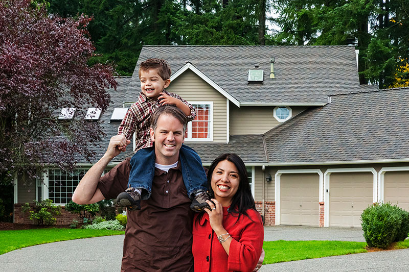 Father, Mother & Son Standing Outside of Their Home - Home Insurance Ontario - DG Bevan Insurance Brokers
